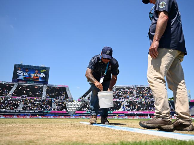 NEW YORK, NEW YORK - JUNE 03: Groundstaff work on the pitch during the interval during the ICC Men's T20 Cricket World Cup West Indies & USA 2024 match between Sri Lanka  and South Africa at  Nassau County International Cricket Stadium on June 03, 2024 in New York, New York. (Photo by Alex Davidson-ICC/ICC via Getty Images)