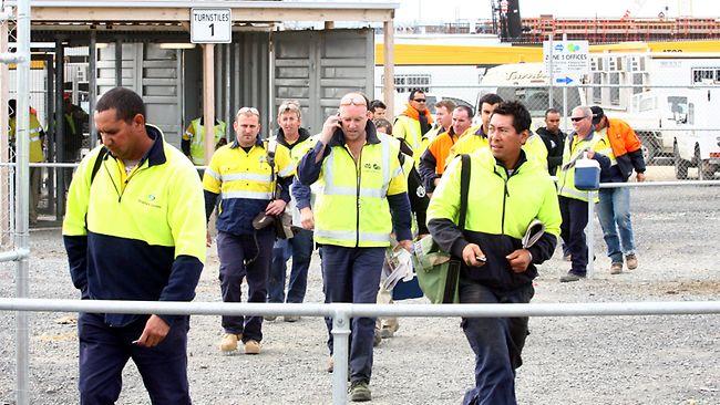 Workers at the desalination plant at Wonthaggi in Victoria walk off the site after a union meeting today. Picture: Aaron Francis