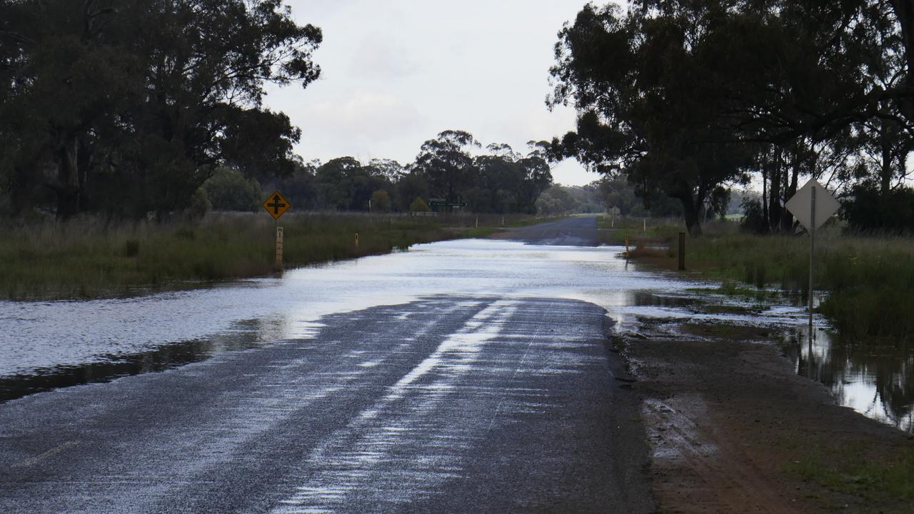 A child has been missing overnight after a car was swept away in the floodwaters. Picture: Darren Madsen