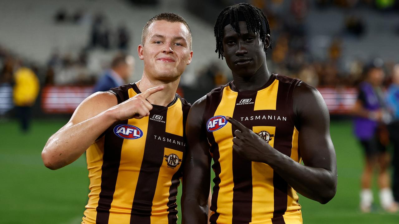 Jack Ginnivan (left) and Changkuoth Jiath celebrate one in a row. Picture: Michael Willson/AFL Photos via Getty Images