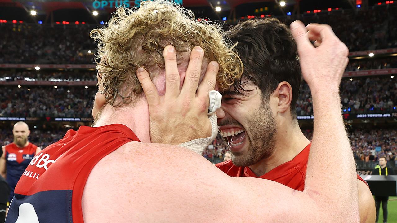 Christian Petracca and Clayton Oliver of the Demons hug after winning the premiership. Picture: Michael Klein