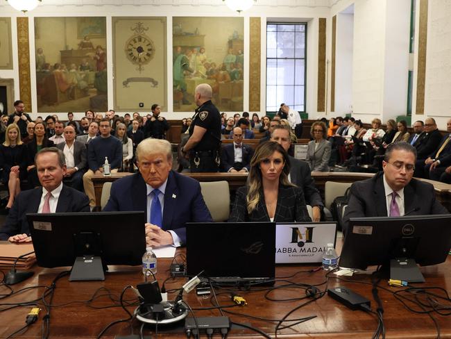 Donald Trump and his legal team at the start of his hearing. Picture: AFP