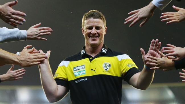 Damien Hardwick celebrates Richmond’s win over Melbourne with fans. Picture: Getty Images