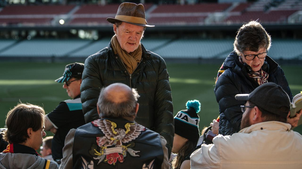 Director Mark Lamprell talks to actors in front of Crows and Port Adelaide fans at Adelaide Oval for film Never Too Late. Picture: Morgan Sette