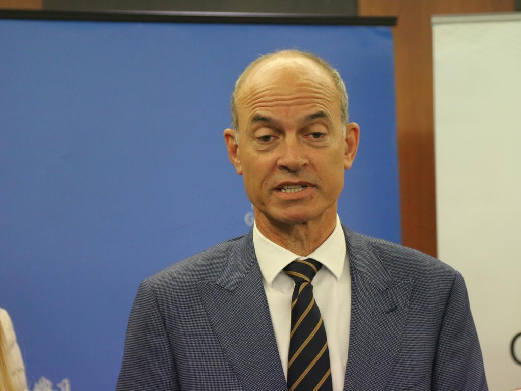 Minister for State Development, Construction and Housing Guy Barnett (centre) speaks to the media after a housing summit in Hobart on Monday, July 11, 2022.