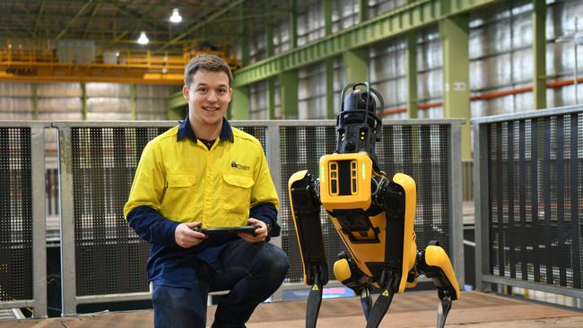 Flinders University robotics engineering graduate Kosta Manning operating the Spot the Dog robot in the Factory of the Futre, Line Zero, Flinders at Tonsley. Supplied.