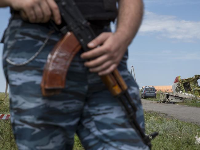 A member of a local militia guards remnants of Malaysia Airlines flight MH17. Picture: Rob Stothard/Getty Images