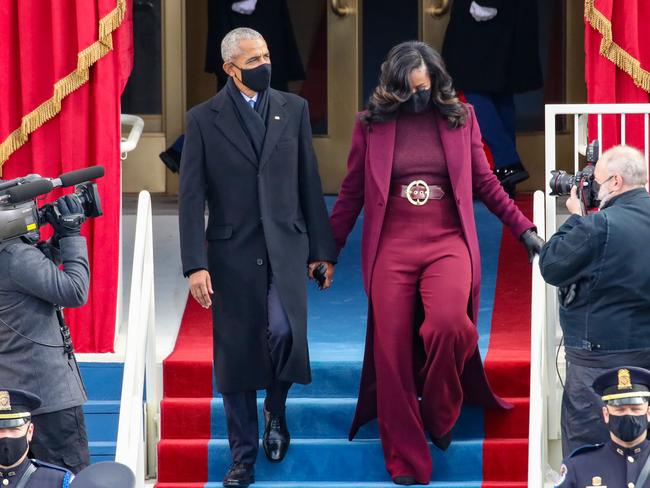 Former President Barack Obama and former first lady Michelle Obama, wearing an outfit similar to Meghan Markle’s latest ensemble in January. Picture: Getty Images