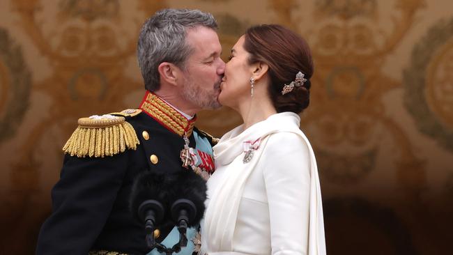 COPENHAGEN, DENMARK - JANUARY 14: Danish King Frederik X kisses his wife Queen Mary of Denmark after his proclamation by the Prime Minister, Mette Frederiksen on the balcony of Christiansborg Palace on January 14, 2024 in Copenhagen, Denmark. King Frederik X is succeeding Queen Margrethe II, who will be stepping down after reigning for 51 years. (Photo by Sean Gallup/Getty Images)