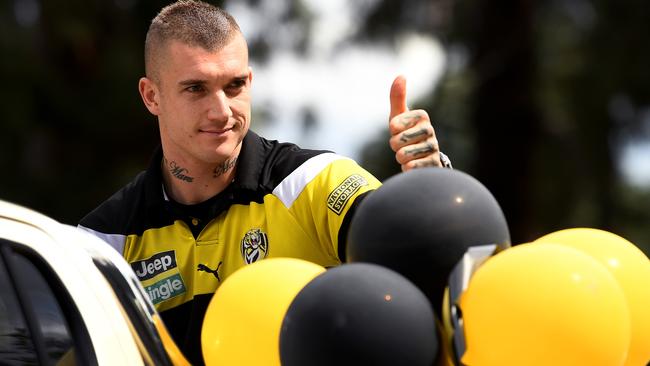 Dustin Martin greets fans at the Grand Final parade.