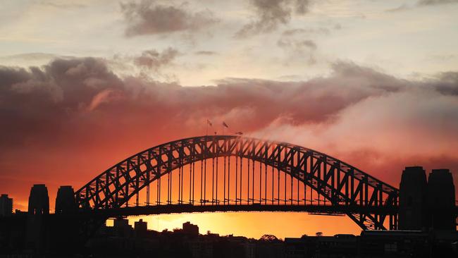 over the Sydney Harbour Bridge, pictured from Looks Avenue in Balmain. Picture: Rohan Kelly