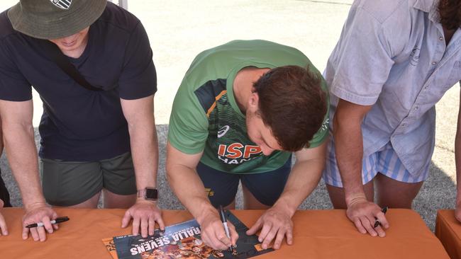 Australian 7s Men's team signing posters after a training session in the Top End ahead of the Olympics. Picture: Darcy Jennings.