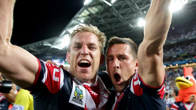 Mitchell Pearce (right) celebrates the Roosters’ 2013 grand final win with Mitch Aubusson.