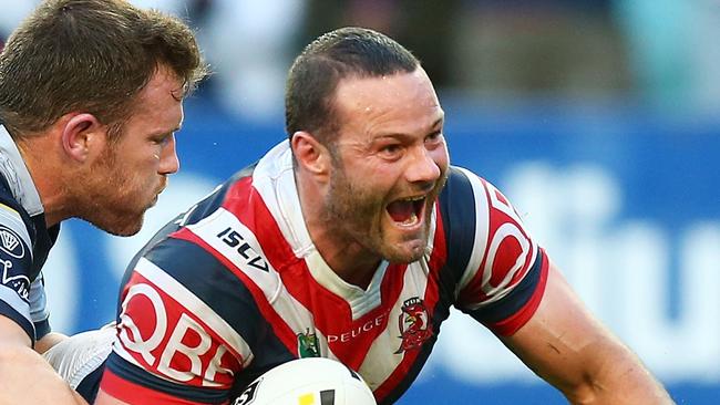 Boyd Cordner of the Roosters celebrates scoring a try.