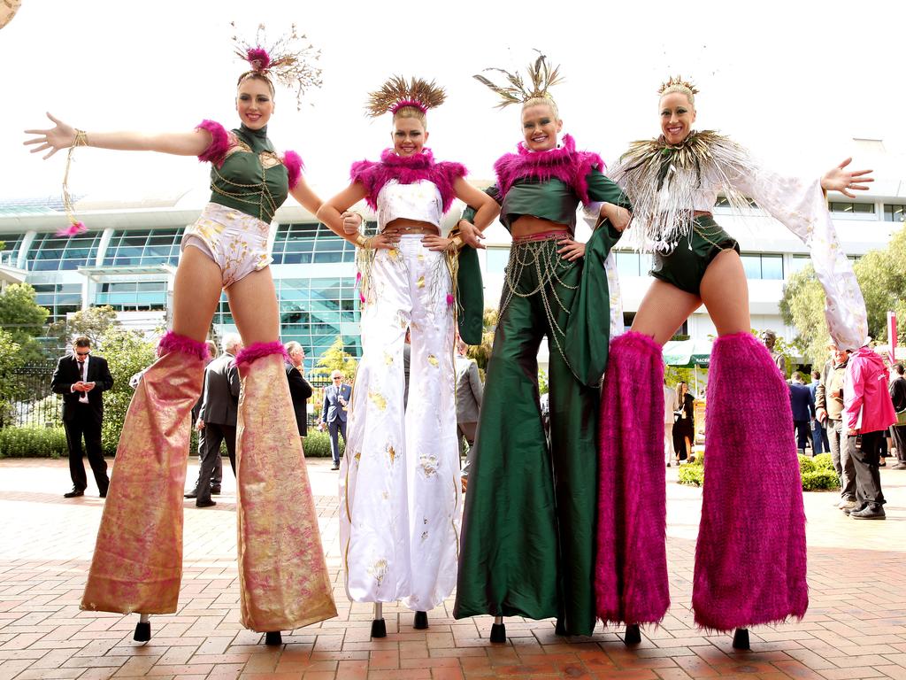 The Stilt Divas welcome racegoers. Picture: Norm Oorloff