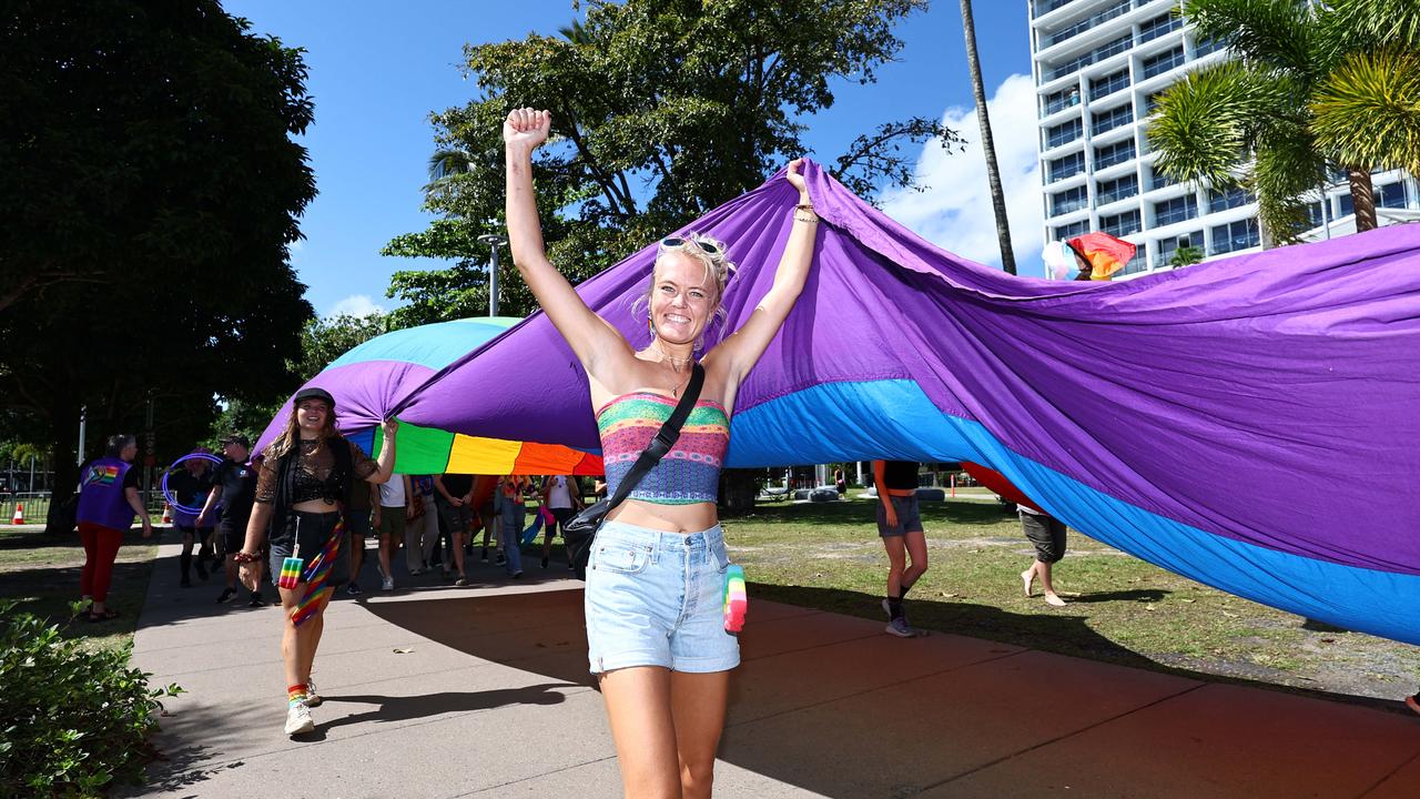 A small group of LGBTIQ people and supporters paraded along the Cairns Esplanade with a huge rainbow flag for the Pride Stride, part of the Cairns Pride Festival. Jeske De Boer holds a huge rainbow flag along the march. Picture: Brendan Radke