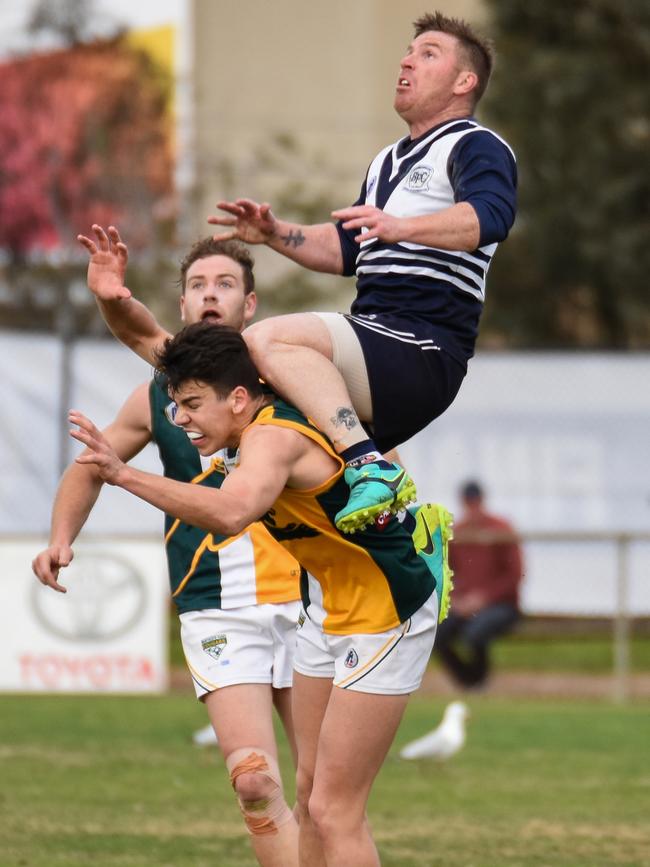 Gary Moorcroft takes a hanger over Northcote Park's Marty Hore. Picture: Nathan McNeill