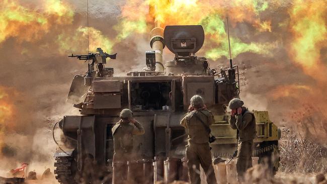 An Israeli army M109 155mm self-propelled howitzer fires rounds near the border with Gaza in southern Israel on October 11, 2023. Israel declared war on Hamas on October 8 following a shock land, air, and sea assault by the Gaza-based militant group. Picture: Jack Guez/AFP