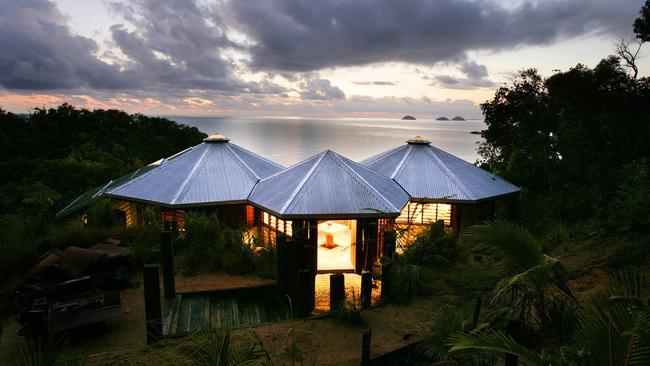 Pictured is a house Mr Vandyke designed on Bedarra Island for photographer Peter Lik, which integrates large boulders into the house and bathroom design.