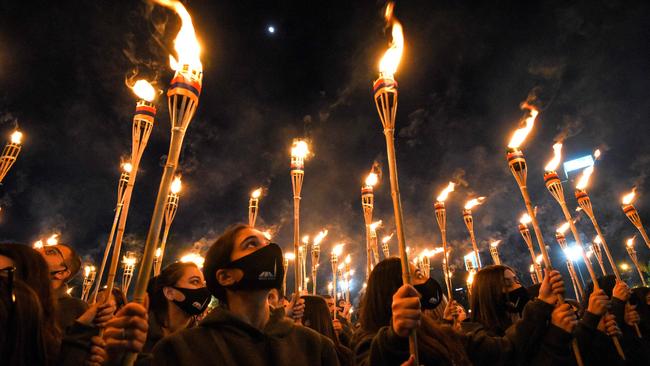 Armenians take part in a torchlight procession in Yerevan to mark the 106th anniversary of World War I-era mass killings.