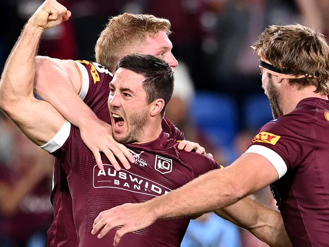 GOLD COAST, AUSTRALIA - JULY 14:  Ben Hunt of the Maroons celebrates with team mates after scoring a try during game three of the 2021 State of Origin Series between the New South Wales Blues and the Queensland Maroons at Cbus Super Stadium on July 14, 2021 in Gold Coast, Australia. (Photo by Bradley Kanaris/Getty Images)