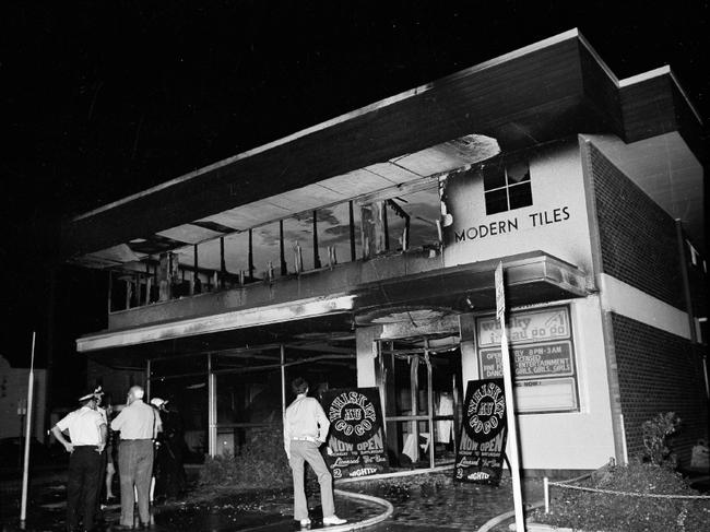 Police outside the destroyed Whiskey Au Go Go.