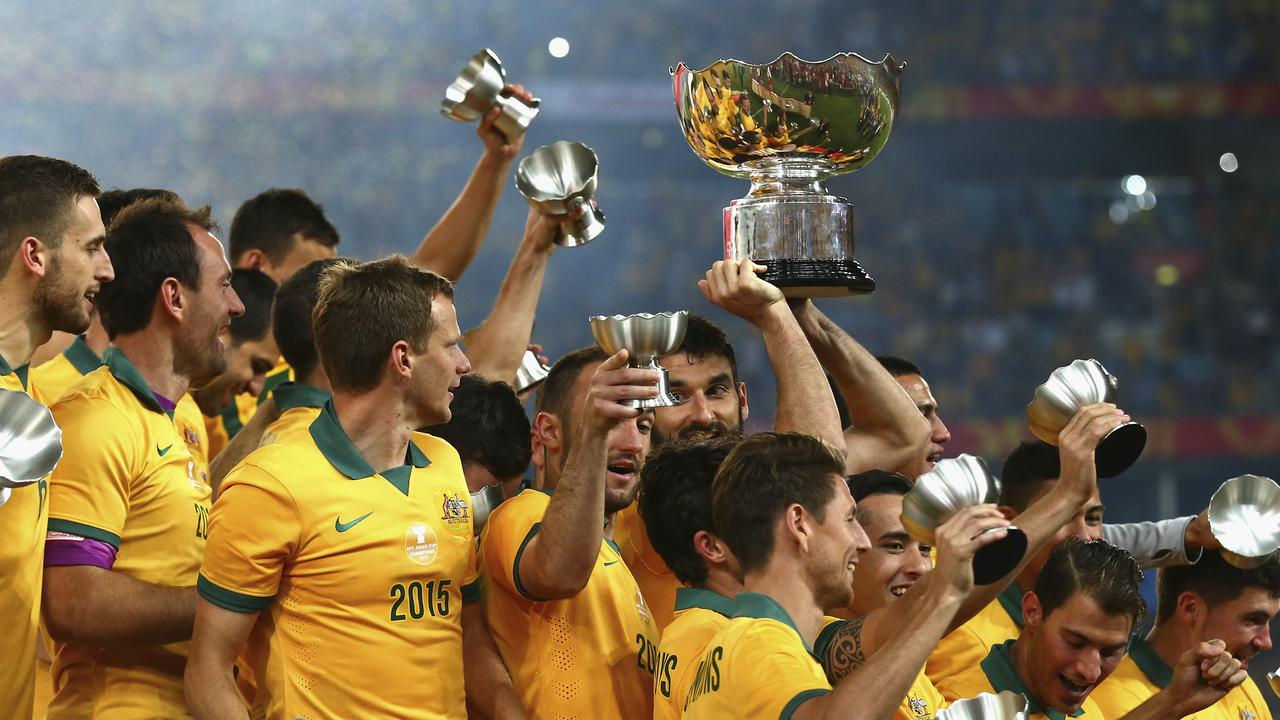 Mile Jedinak of Australia lifts the 2015 Asian Cup after victory in the final against Korea Republic at ANZ Stadium. Picture: Getty Images