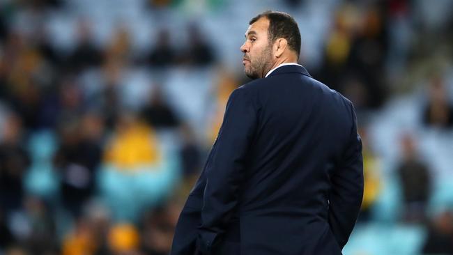 Wallabies coach Michael Cheika watches his players warm up at ANZ Stadium.