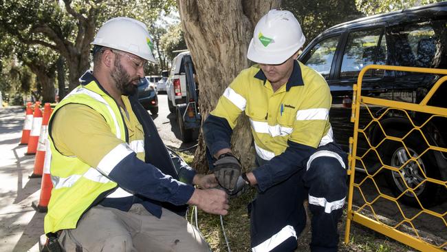 Contractors working on the rollout of the NBN network. Pic: AAP