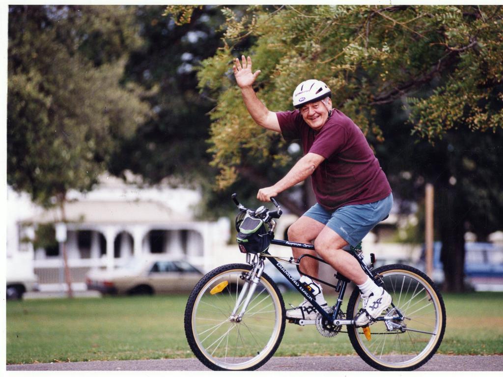 Bob Francis riding his bicycle through Wellington Square, North Adelaide, February, 1996.