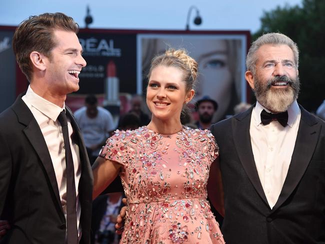 Mel Gibson, Andrew Garfield and Teresa Palmer arrive for the premiere of “Hacksaw Ridge” presented out competition at the 73rd Venice Film Festival on September 4, 2016. Picture: AFP