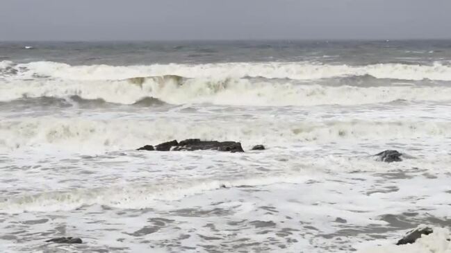 Sunshine Coast wild weather whips up foam 'snow' on beaches