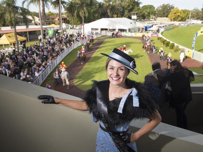 Lauretta Lewis stands high above the parade ring on South Grafton Cup Day after being named the Lady of the Carnival in the Fashions on the Field competition.