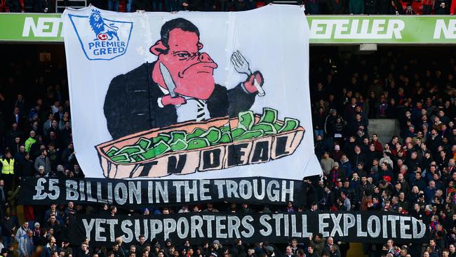 Fans display a banner in relation to the recent TV deal.