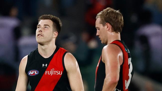 MELBOURNE, AUSTRALIA - AUGUST 10: Zach Merrett of the Bombers looks dejected after a loss during the 2024 AFL Round 22 match between the Essendon Bombers and the Gold Coast SUNS at Marvel Stadium on August 10, 2024 in Melbourne, Australia. (Photo by Michael Willson/AFL Photos via Getty Images)