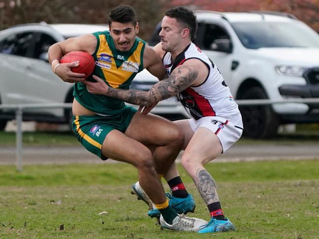 Declan Brunell (right) sticks a tackle. Picture: Valeriu Campan