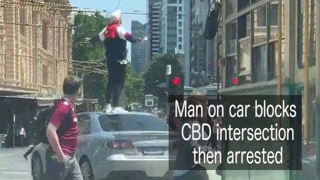 Man on car blocks CBD intersection then arrested