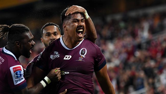 Alex Mafi celebrates scoring a try during the Round 14 Super Rugby match between the Queensland Reds and the NSW Waratahs last year.