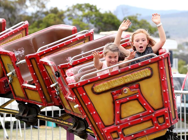 Olivia Rayner 8 of Glenorchy, left, and Claudia Wright 8 of Moonah enjoying the Madagascar Roller Coaster ride on Hobart Regatta day. Picture: SAM ROSEWARNE