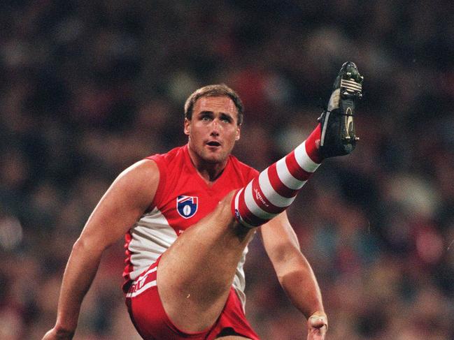 Tony Lockett boots a goal for the Swans.