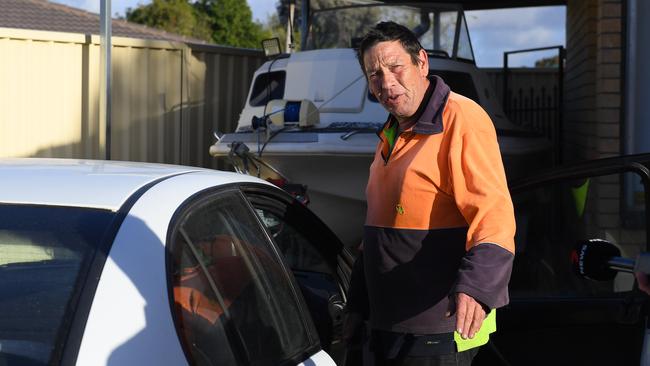 The father of the man arrested speaks to media outside the home on Thursday morning. Picture: Mark Brake