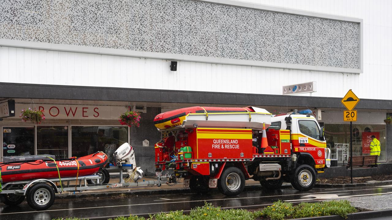 QFES swift water rescue crews outside Rowes after flood water again inundated Russell St businesses, Saturday, February 26, 2022. Picture: Kevin Farmer