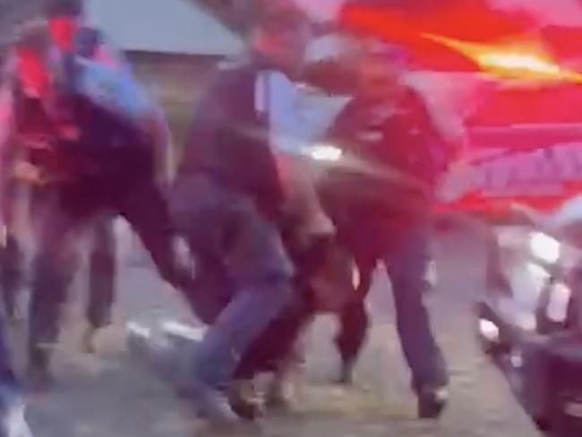 Wild footage has emerged of an officer crash-tackling a teenager and dragging him along the ground by his hoodie at Casino on January 11, 2025 following a police pursuit, sparking community outrage.