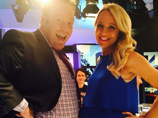 Carrie Bickmore while pregnant poses with The Project co-host Peter Hellier.