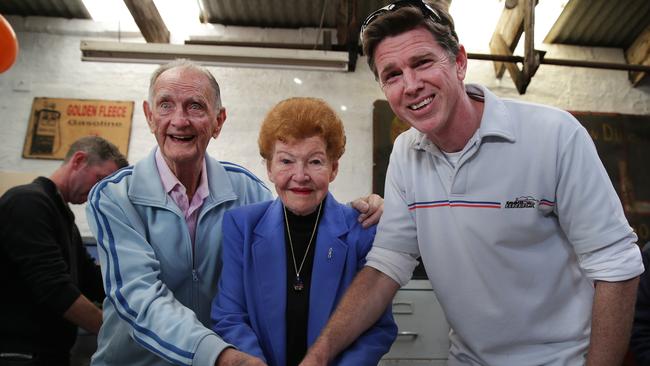 Old Phil, wife Joan and Young Phil cut the cake to celebrate O'Sullivan's Garage that has been at 198 Denison Street, Bondi and run by the same family for 90 years. Picture: Daniel Aarons