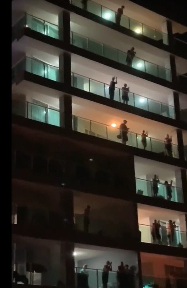 Redcliffe residents stand on their balconies to give a round of applause to show their appreciation for front line workers during the COVID-19 outbreak.