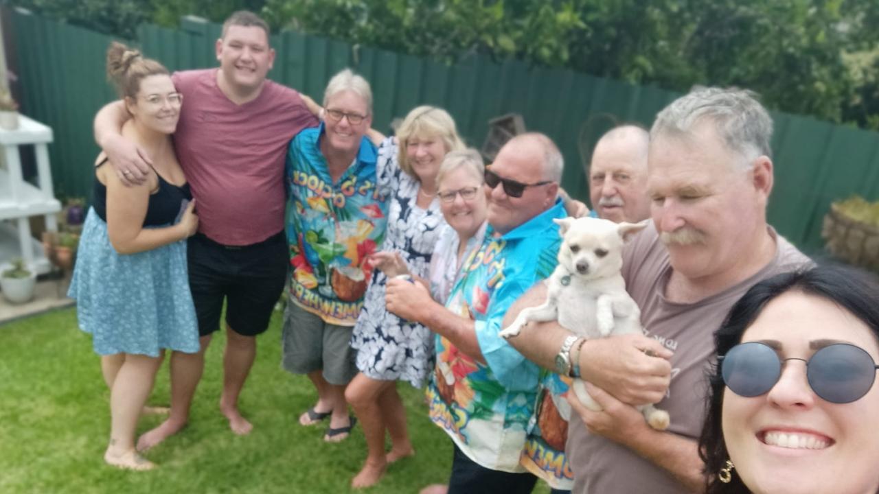 A relaxed Mr Tougher poses with wife Madison and his broader family. Picture: Facebook, Jill Tougher