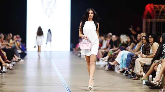 Model Chloe Destiny showcases handbags designed by Voay Australia on the first night's runway show at Cairns Fashion Week, held at the Screen Queensland studios. Picture: Brendan Radke