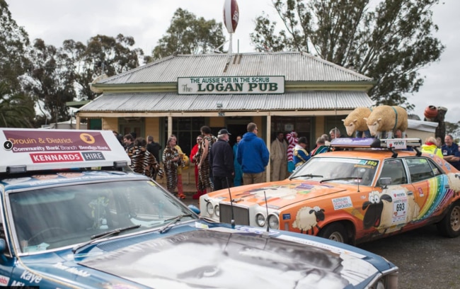 The participants of last year's Variety Bash pull over at a pub in the Rural town of Logan, Queensland.