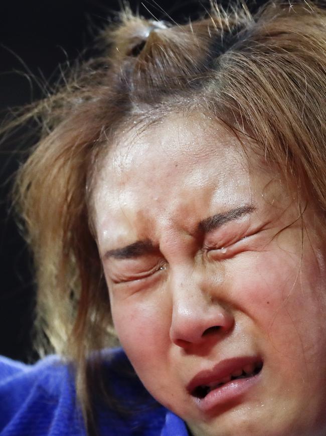 Bak Ji-yun of South Korea cries after her loss to Alice Schlesinger of Great Britain during the women’s 63 kg judo